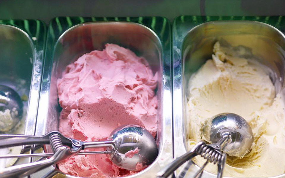 Strawberry and vanilla gelato in a display case